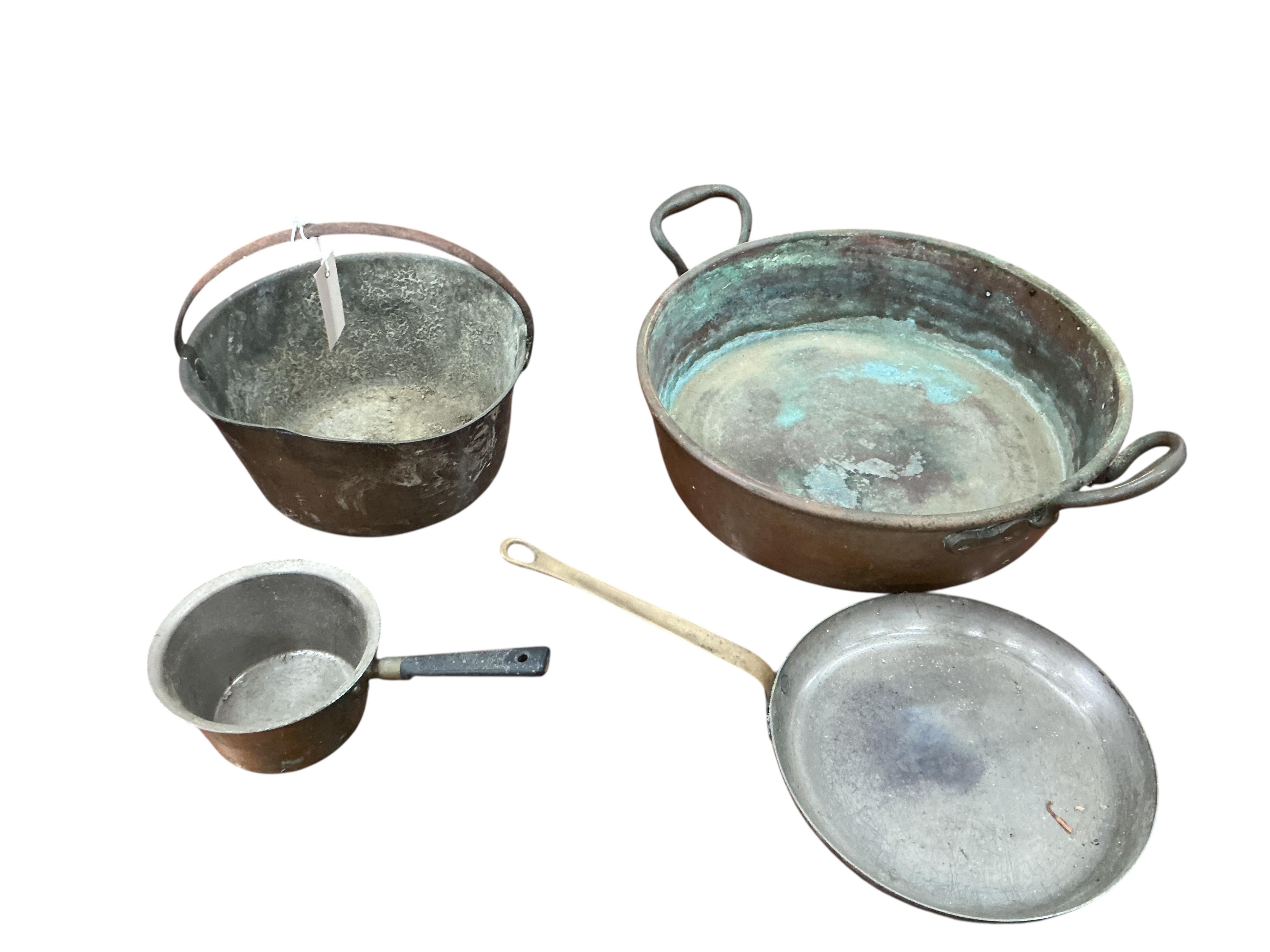 A Victorian brass preserve pan, diameter 48cm and three further pans